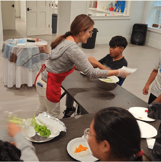 Chef teaching kids culinary arts